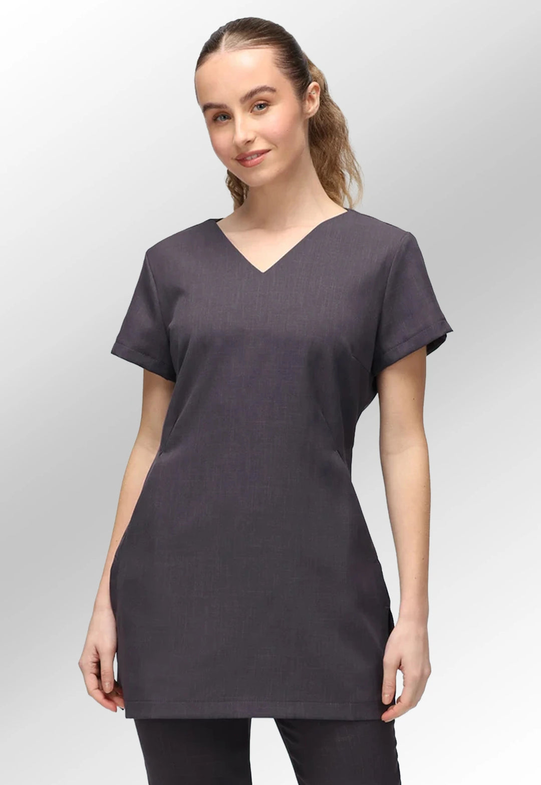 Front view of model wearing the La Beeby Grey Nina V Neck Salon Tunic with Pockets.
