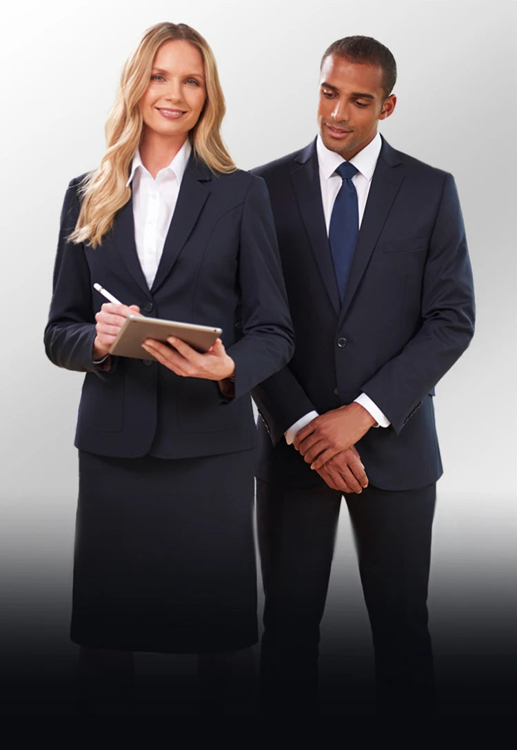 Two professionals, a woman and a man in Brook Taverner Performance Collection suits