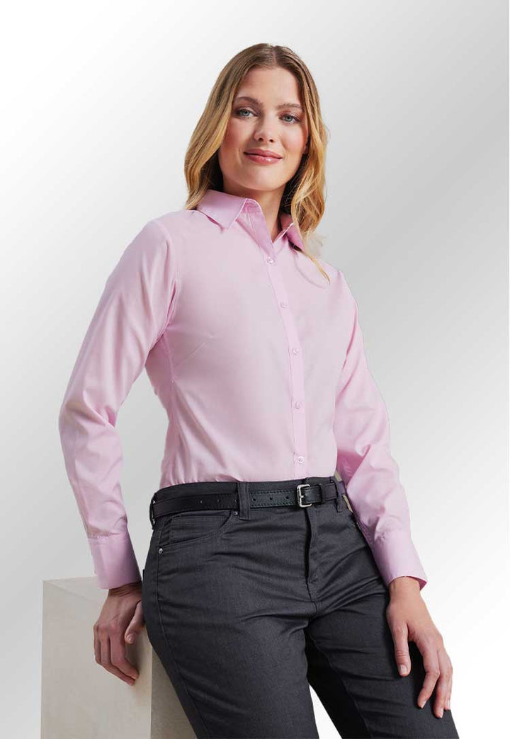 Model wearing PR300 Women's poplin long sleeve blouse in Pink