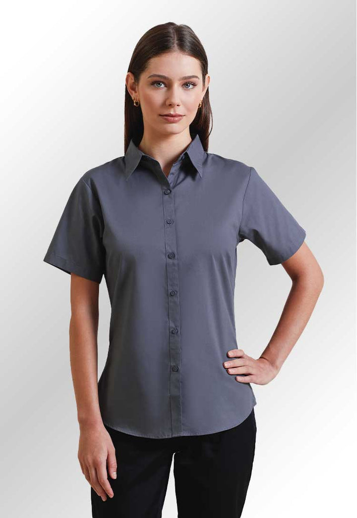 Model wearing a PR302 Women's short sleeve poplin blouse in Steel