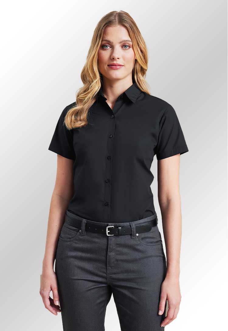 Model wearing a PR309 Women's supreme poplin short sleeve shirt in Black