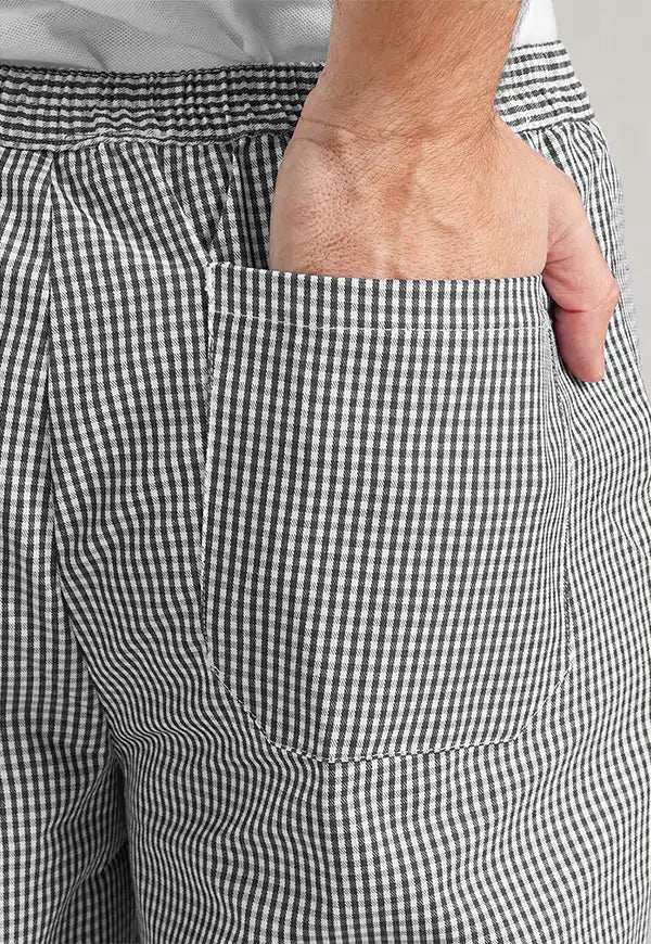 Back close-up of model wearing the Pull On Chef's Trousers PR552 in Black/White.