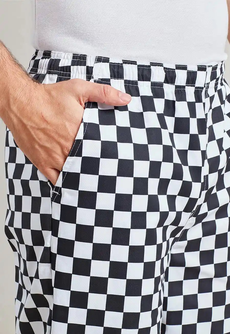 Close-up of model wearing the Essential Chef's Trousers PR553 in Black/White Check.
