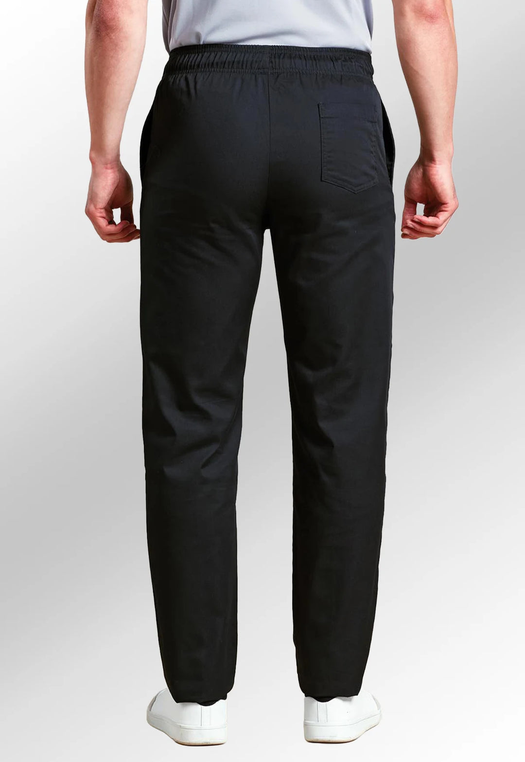 Rear view of model wearing the Chef's Select Slim Leg Trousers PR554 in Black.
