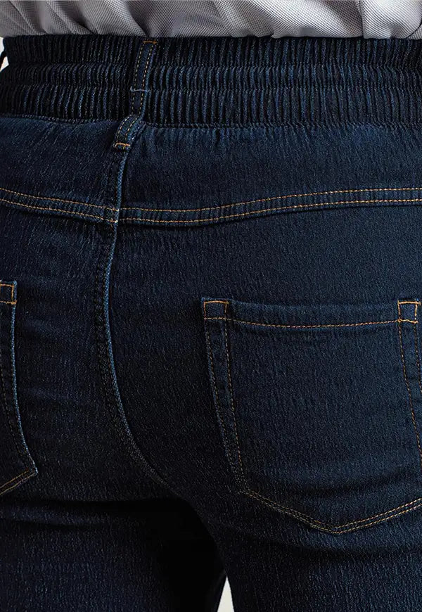 Close-up rear view of model wearing the Premier Workwear Chef's Artisan Jogger Bottoms PR556 in Indigo Denim.