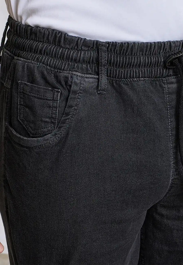 Waist close-up of model wearing the Chef's Artisan Jogger Bottoms PR556 in Black Denim.