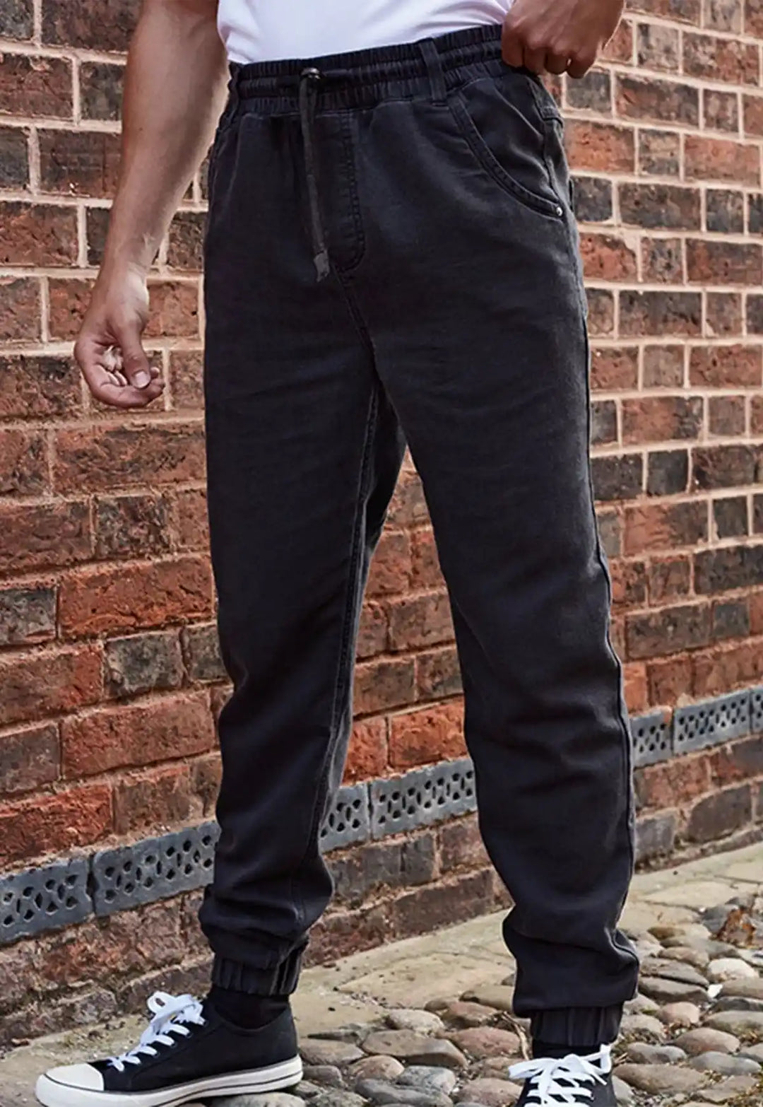 Lifestyle photo of model wearing the Chef's Artisan Jogger Bottoms PR556 in Black.