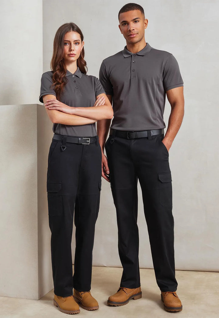 Female and male model wearing the Premier Stretchchecker Unisex Work Cargo Trousers in Black.