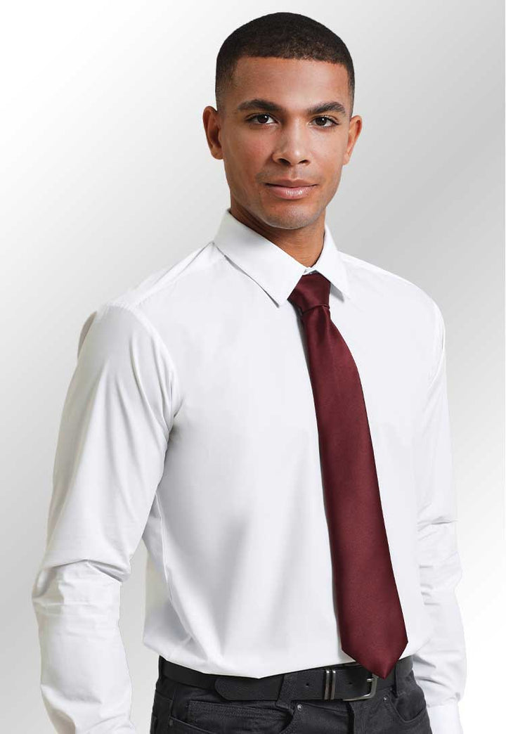 Model wearing a white shirt with a PR750 'Colours' satin tie in Burgundy