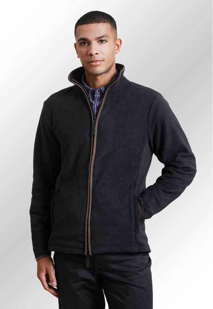 Model wearing a PR823 Artisan fleece jacket in Black/Brown