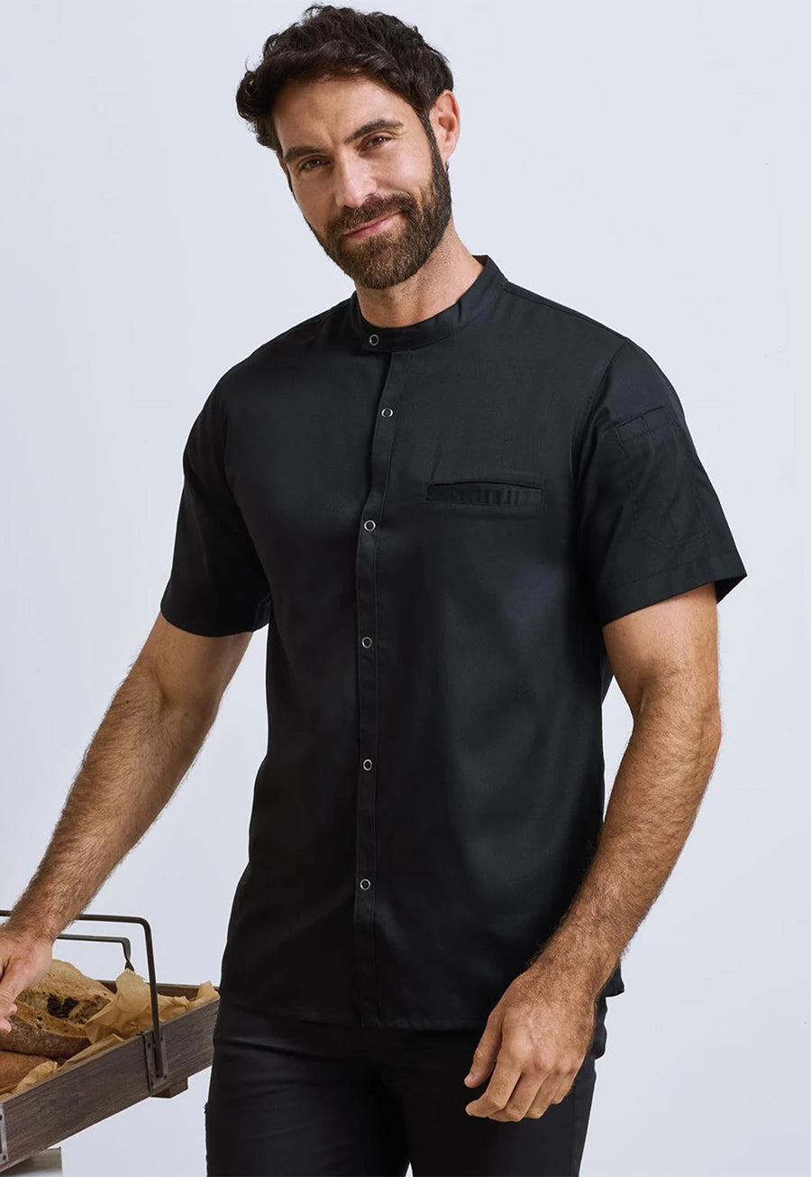 Model wearing the Premier Workwear Chef's 'Recyclight' Short Sleeve Shirt PR904 in Black.