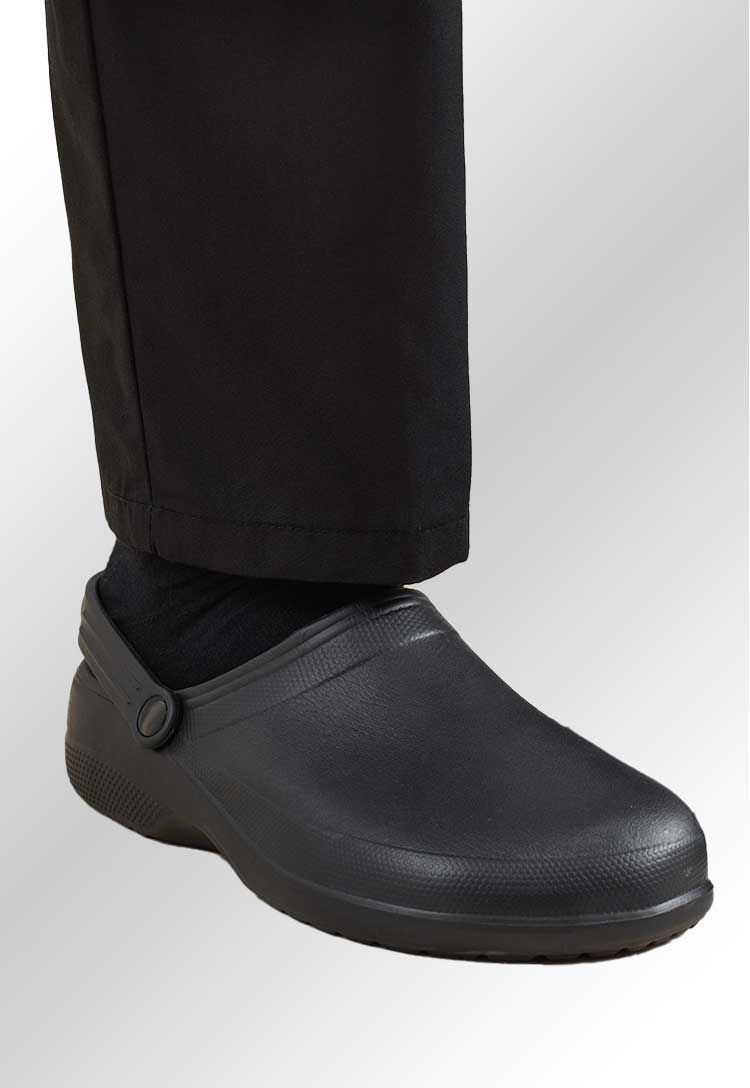 A model's foot wearing PR910 Chef's Non-Slip Anchor Clogs in Black