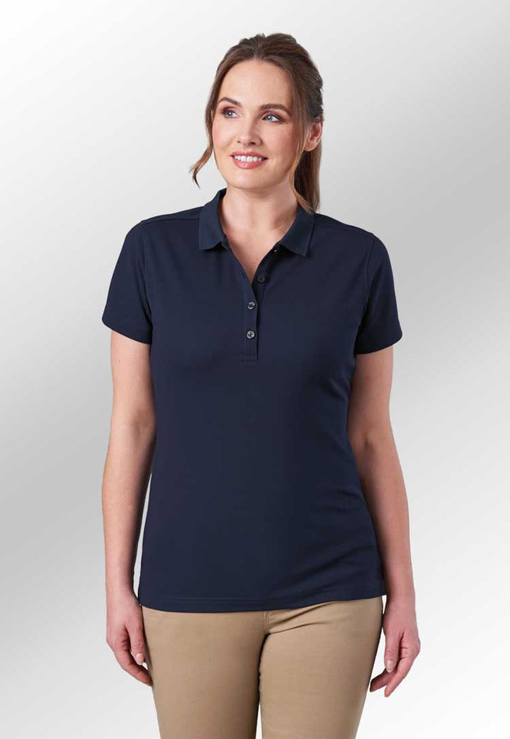 Laurel performance polo in white modelled brunette