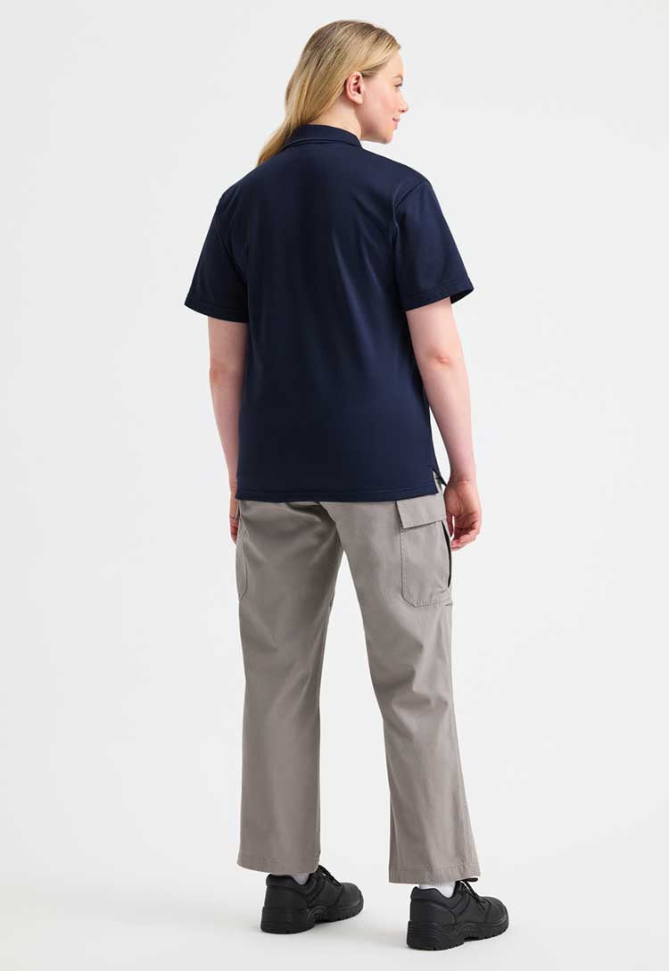 full length back view of model wearing uneek Processable Polo Shirt  in navy