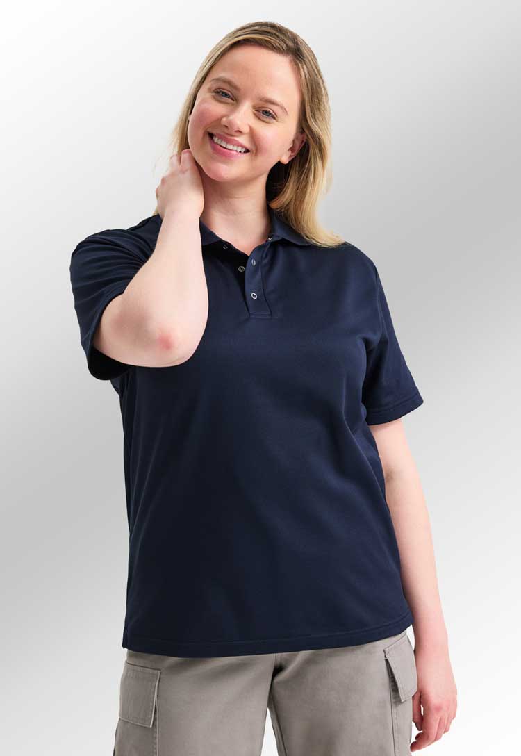 model wearing uneek Processable Polo Shirt  in navy