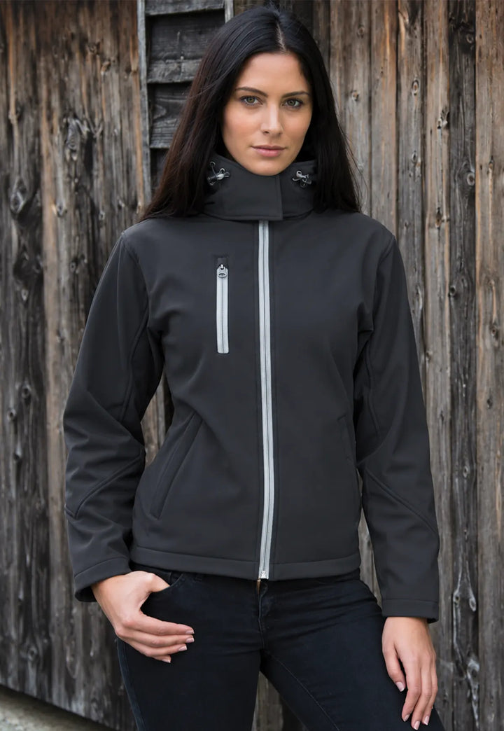 Model wearing the Women's Core TX Performance Hooded Softshell Jacket in Black/Grey.