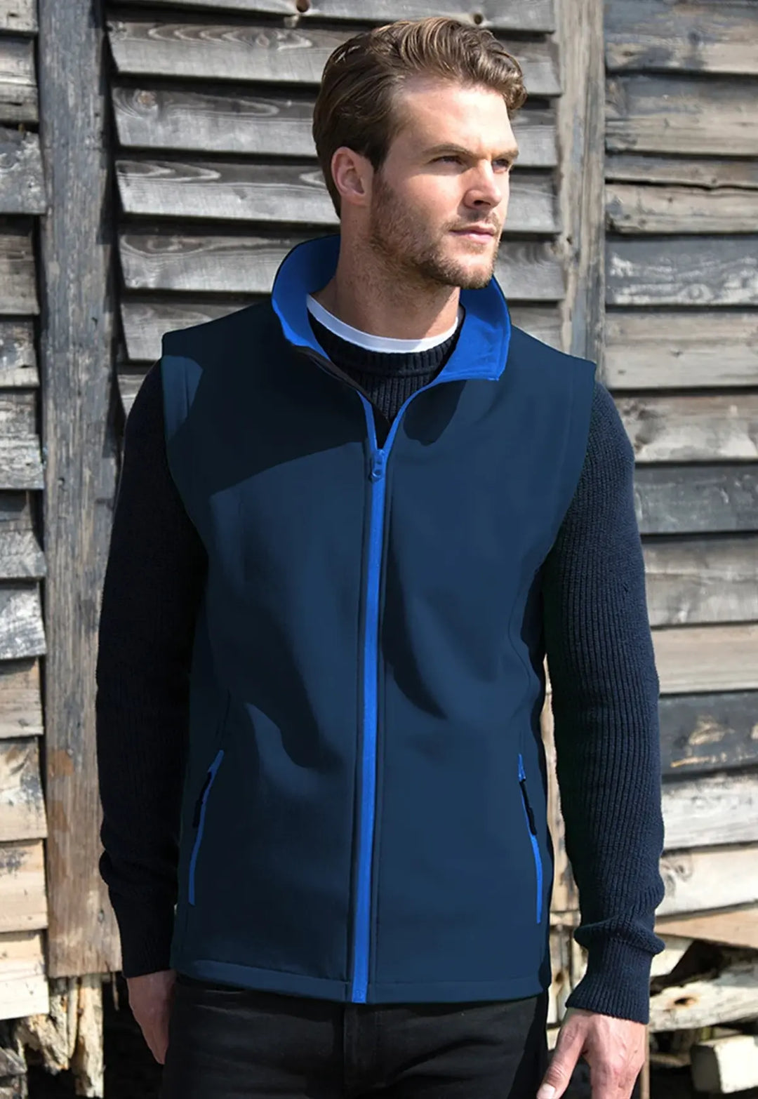 Model wearing the Men's Printable Softshell Bodywarmer R232M in Navy/Royal.