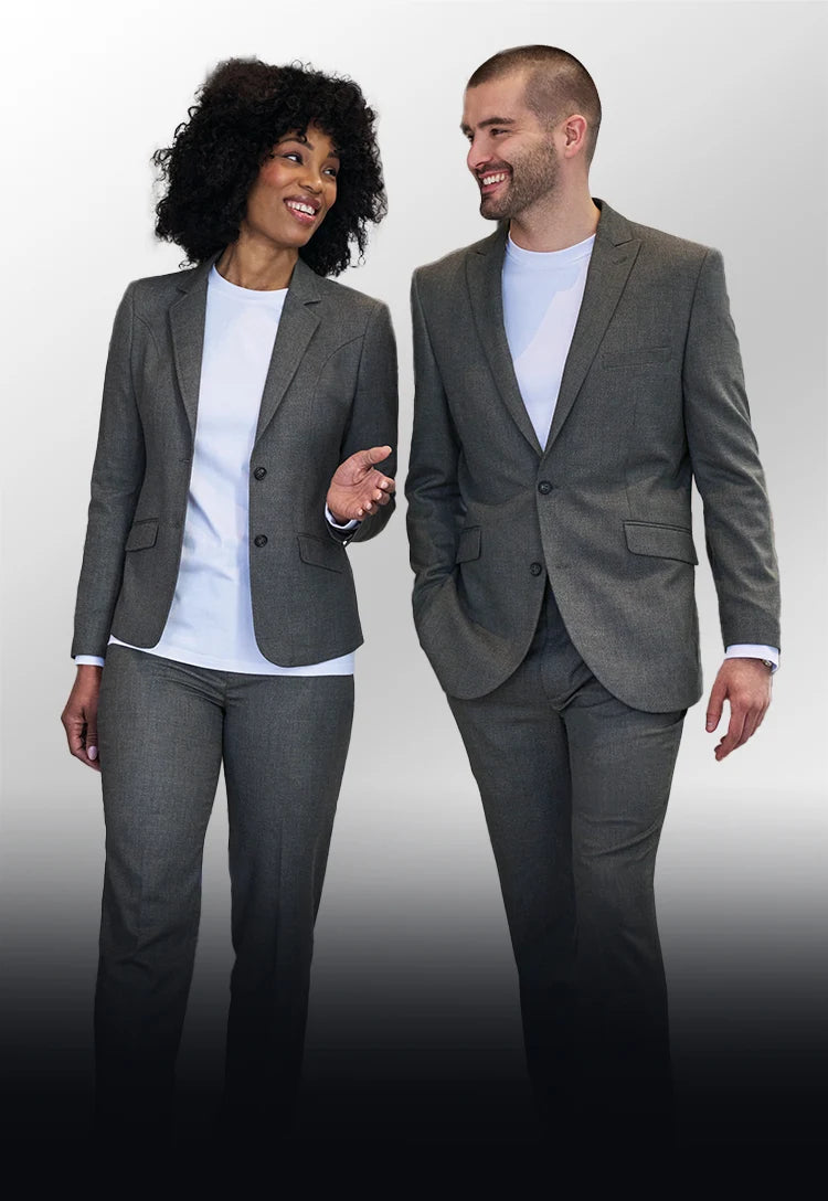 A woman and man wearing Brook Taverner Rapport Collection grey suits