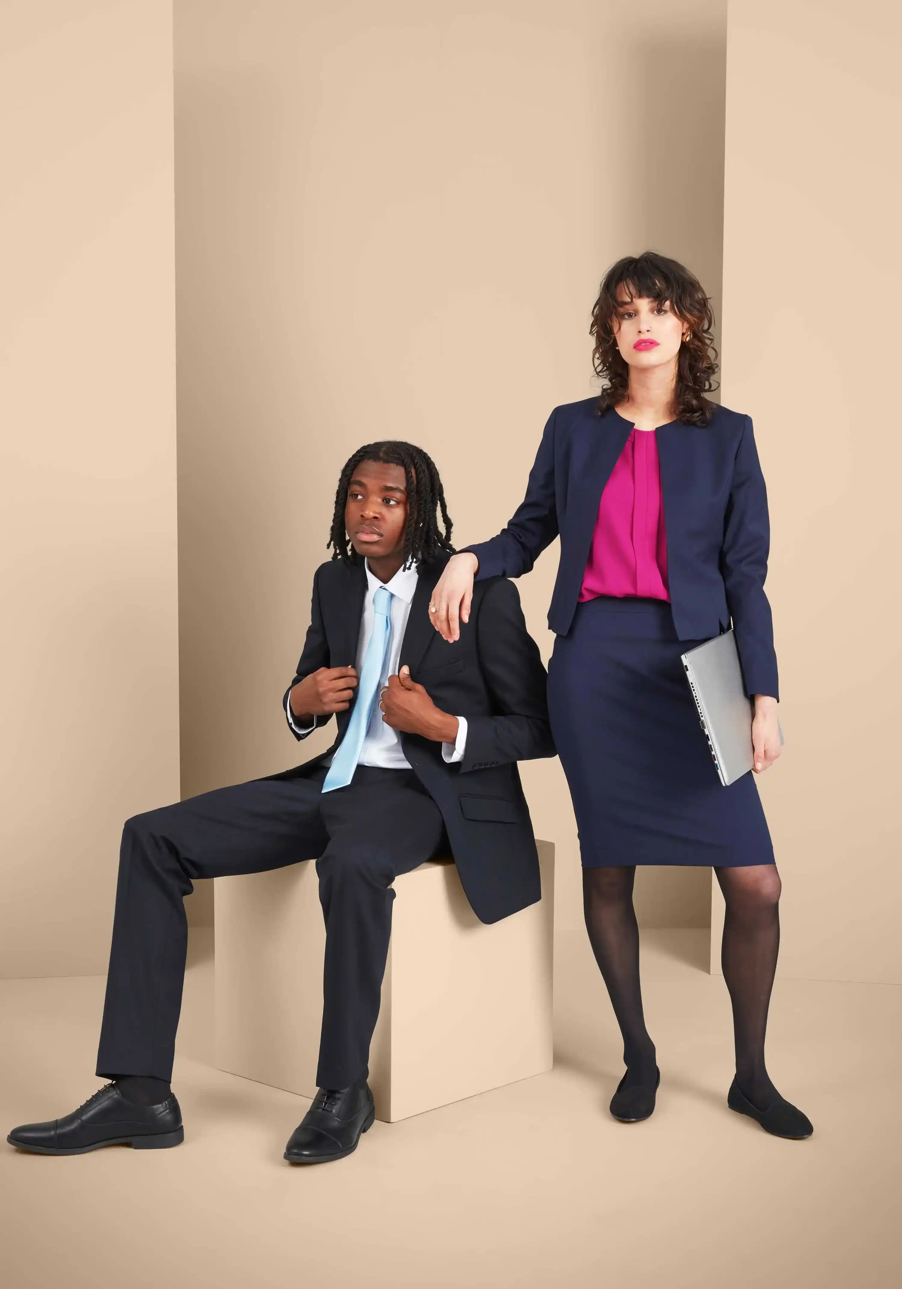 2 models wearing Work Uniform Company's Reception uniforms