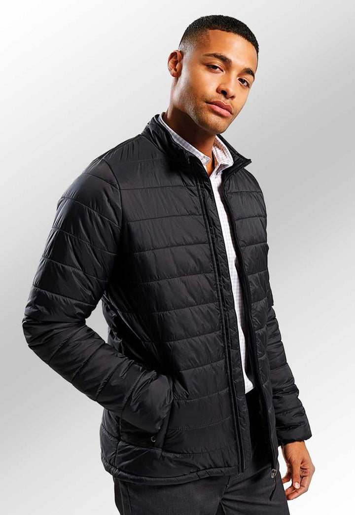 Model wearing ‘Recyclight’ Padded Jacket PR817 in black