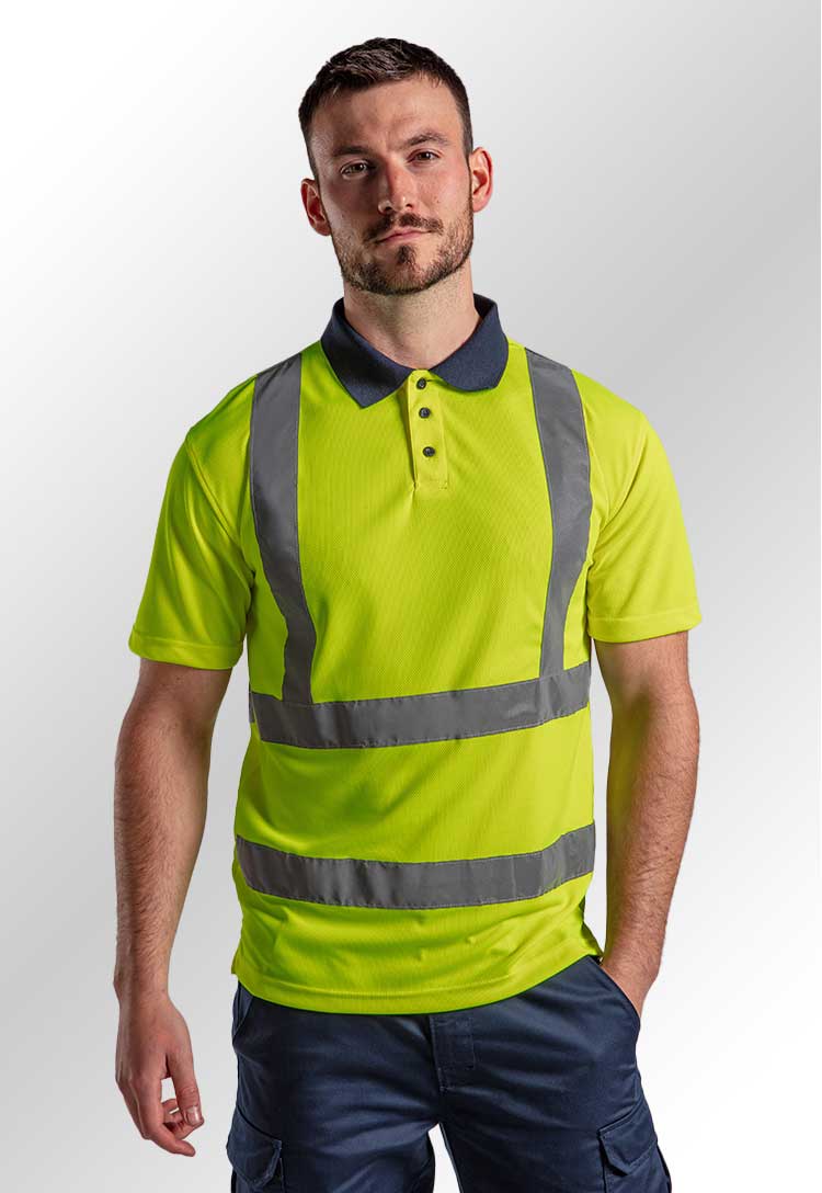 A model wearing an RX710 High Visibility Polo in HV Yellow/Navy