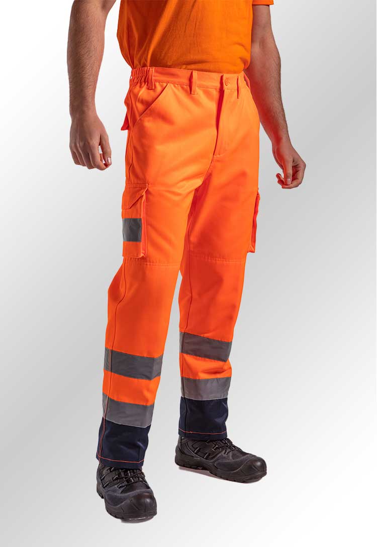 A model's legs wearing the RX760 Cargo Trousers in HV Orange