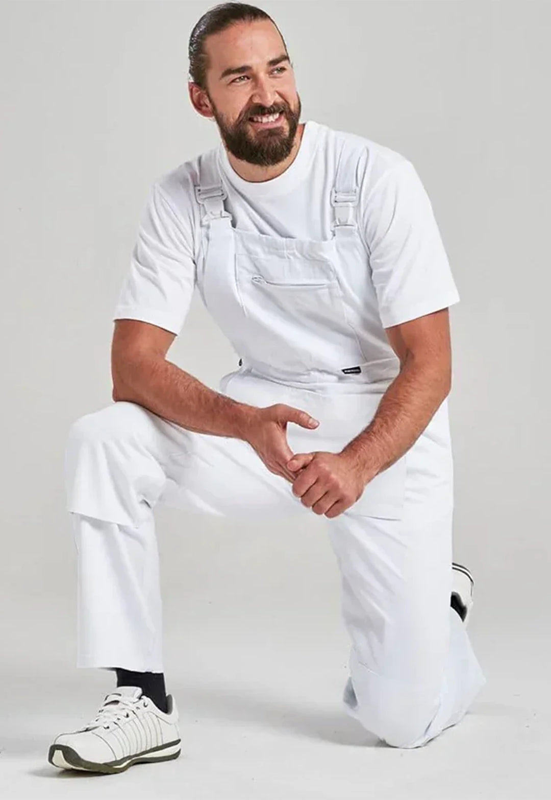 Model wearing the Portwest Bolton Painters Bib & Brace S810 in White.