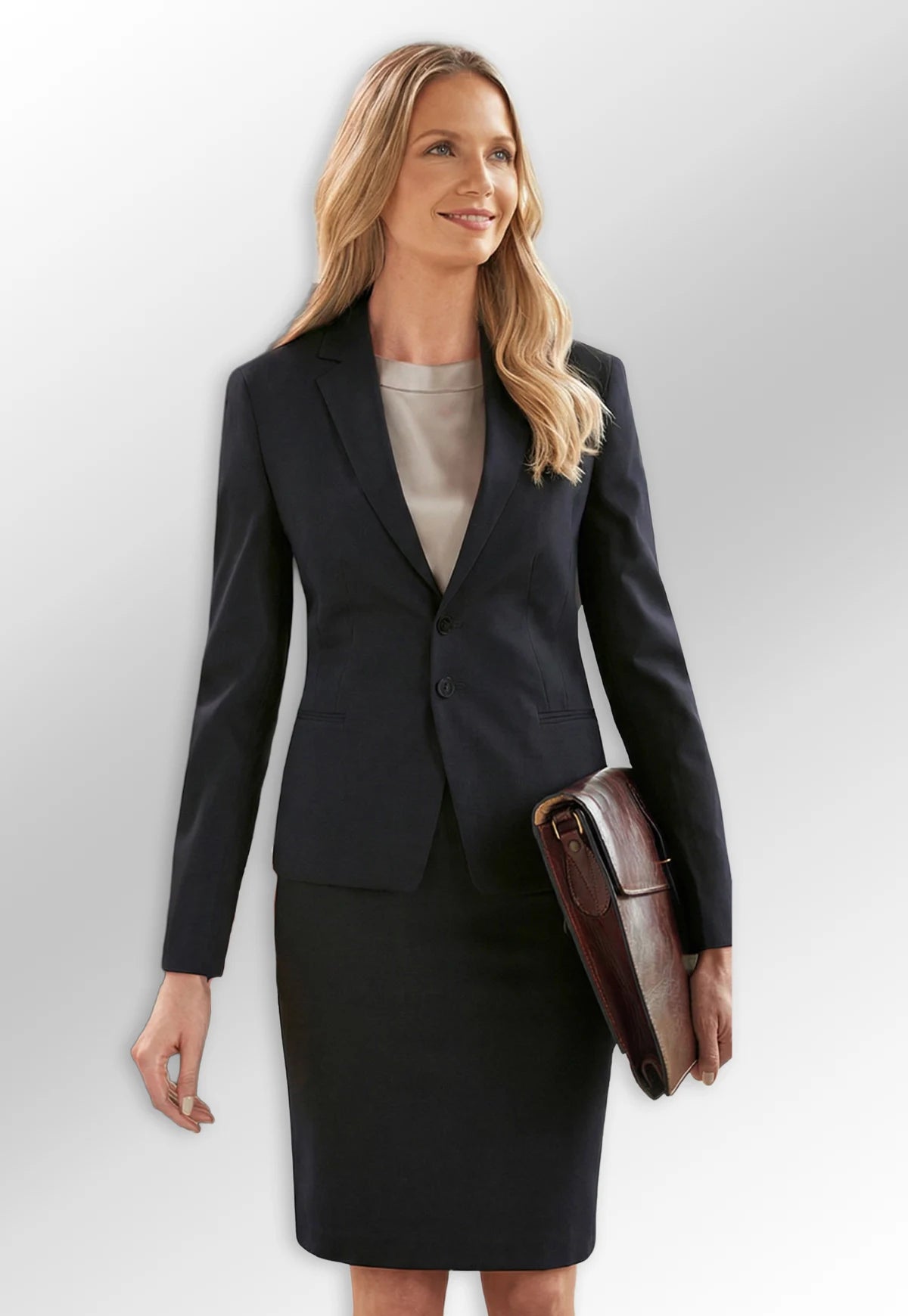 Model wearing Ladies' Black Suit Jacket & Skirt from the Brook Taverner Sophisticated Womenswear Collection.
