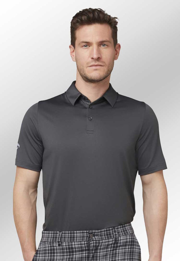 Swing Tech™ Solid Golf Polo in grey worn by model