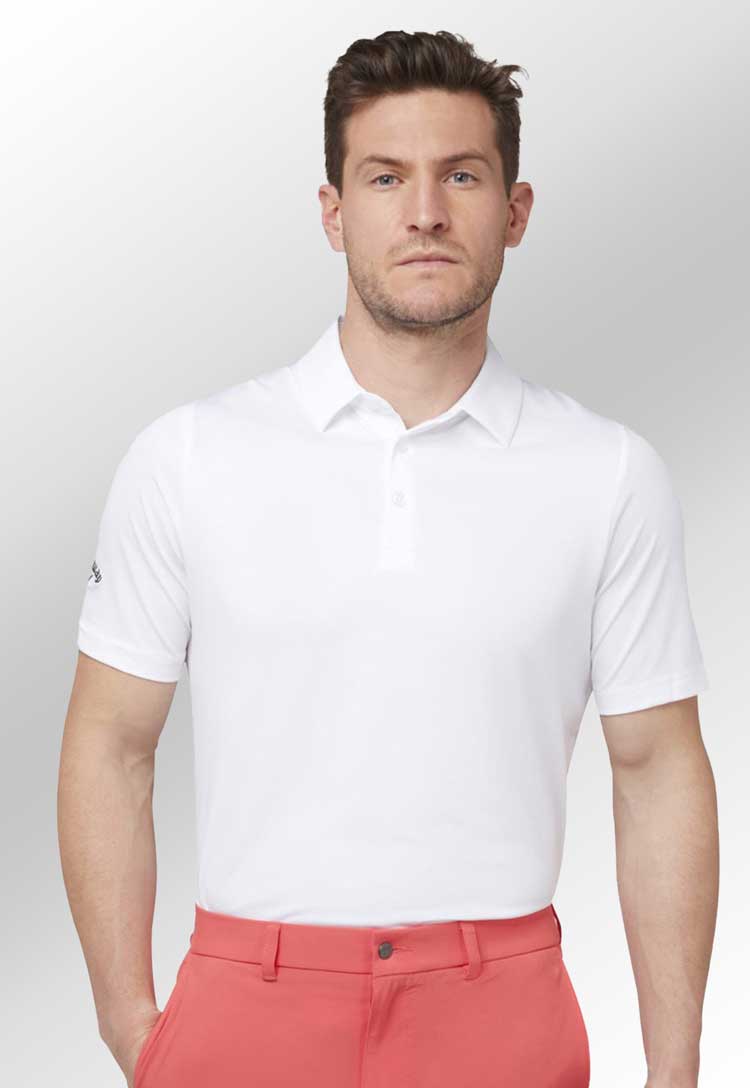 Swing Tech™ Solid Golf Polo in white worn by model