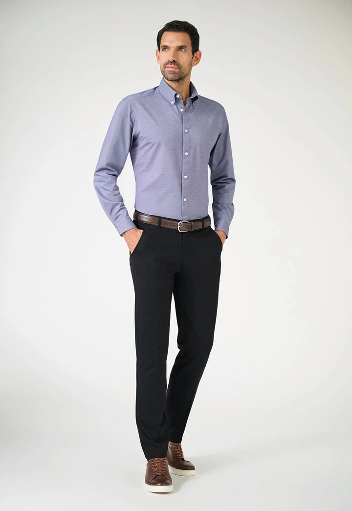 Model wearing the Brook Taverner Taurus Jersey Stretch Men's Trousers in Black.