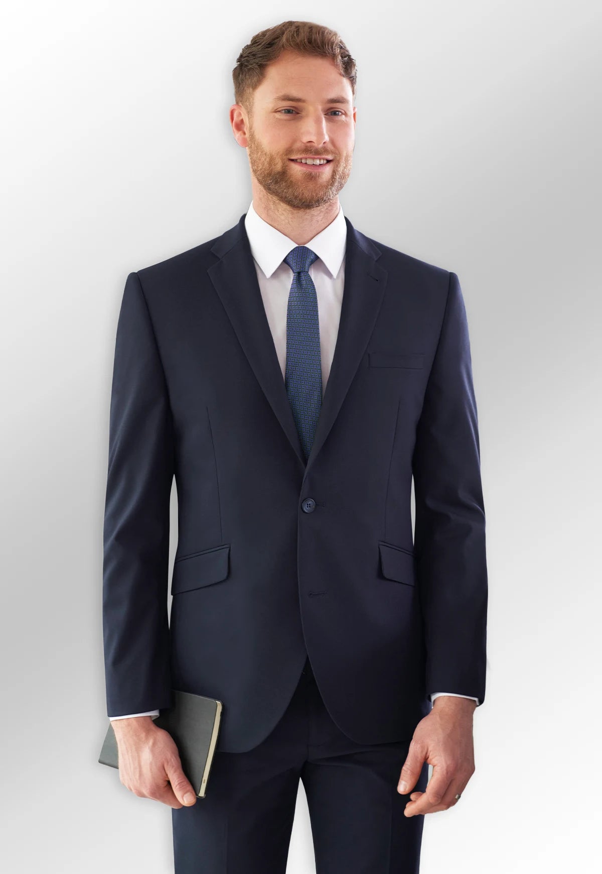 Model wearing the Dijon Tailored Fit Jacket and Monaco Tailored Fit Trousers in Navy from the Brook Taverner Today Menswear Collection.