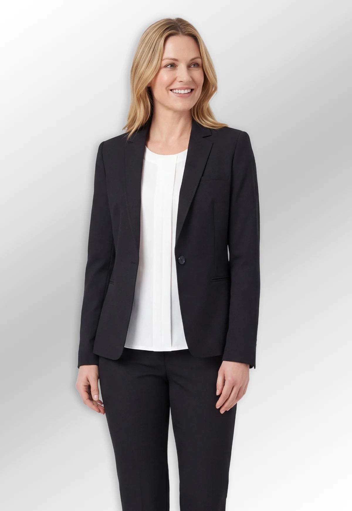 Model wearing Suit Jacket & Trousers from the Brook Taverner Today Womenswear Collection.