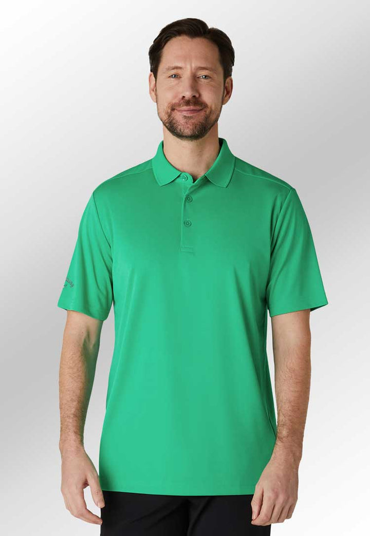 Model wearing Golf Tournament Polo CW032 in green