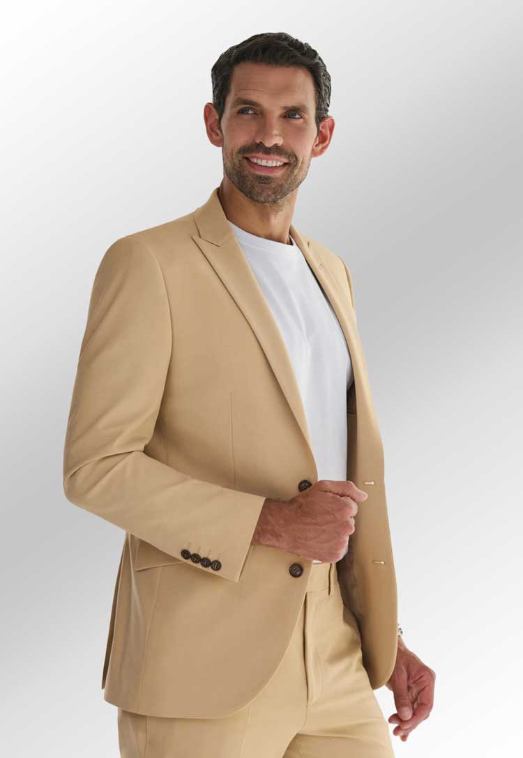 Model Wearing William Tailored Fit Jacket 5427 in Sand