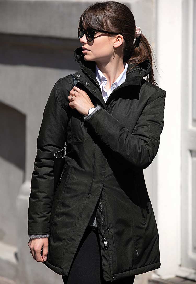 Model Wearing Women’s Mapleton Urban Tech Parka Jacket NB77F in Black