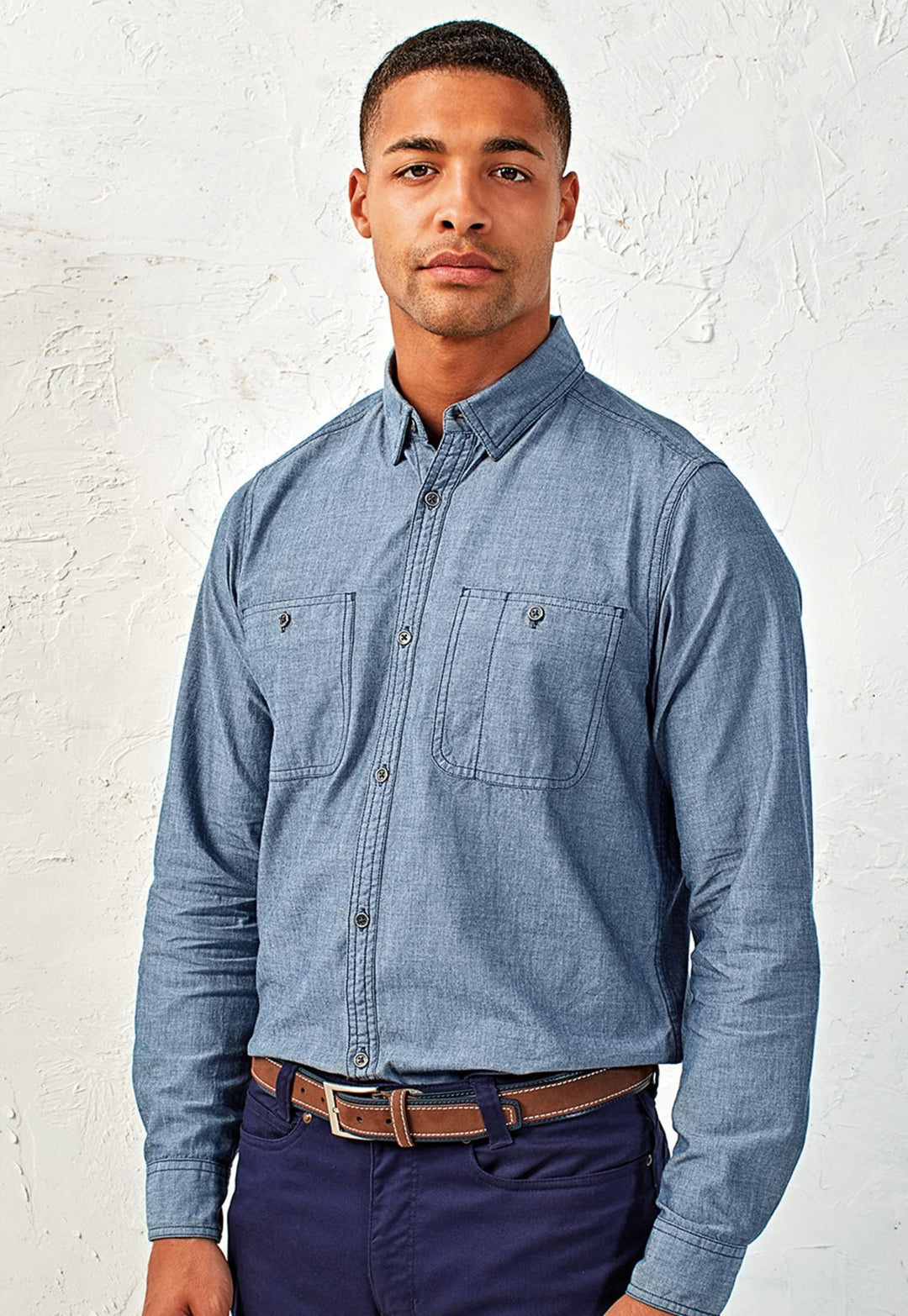 Model Wearing Men’s Chambray Shirt, Organic and Fairtrade Certified PR247 in Indigo Denim