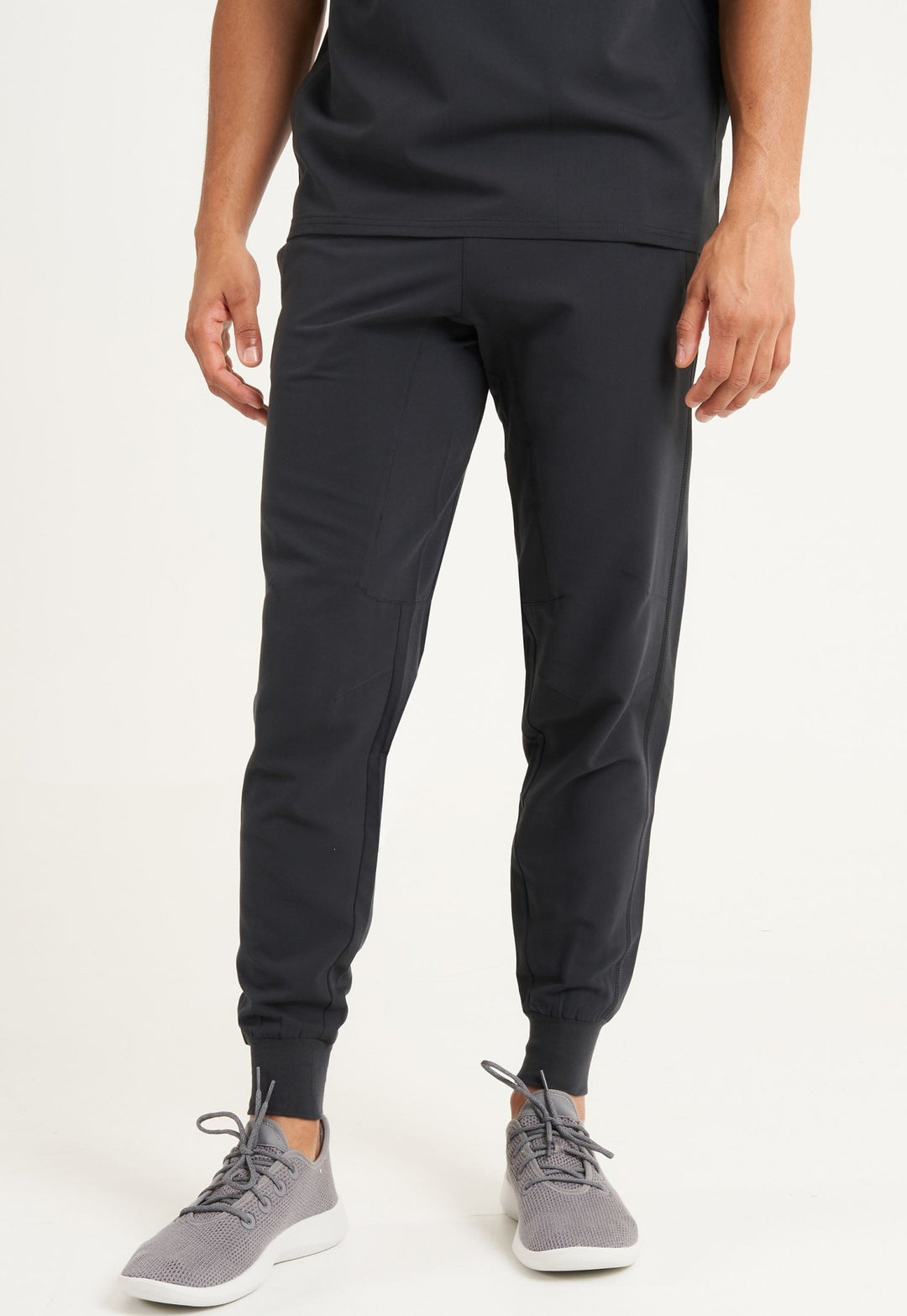 Model Wearing Simki Maxwell Men's Scrub Jogger Pants 4953 in Black